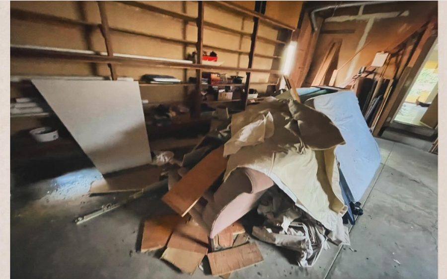 Garage filled with debris before removal